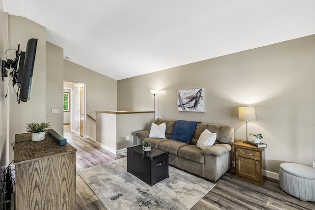 809 Orchard St, Belle Plaine, MN 56011 - living room featuring light wood finished floors, lofted ceiling, and baseboards