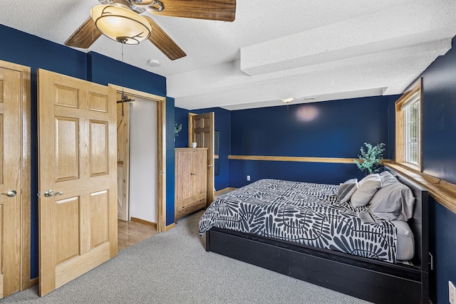 809 Orchard St, Belle Plaine, MN 56011 - bedroom with carpet, a ceiling fan, a textured ceiling, and baseboards