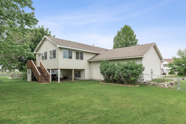 809 Orchard St, Belle Plaine, MN 56011 - rear view of property featuring stairway, roof with shingles, and a deck