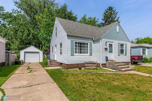 1538 10th St N, Fargo, ND 58102 - view of front facade featuring a shingled roof, an outbuilding, driveway, a garage, and a front lawn