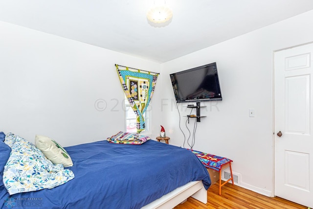 1538 10th St N, Fargo, ND 58102 - bedroom with light wood-type flooring and baseboards