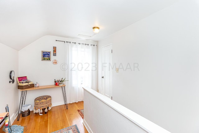 1538 10th St N, Fargo, ND 58102 - hall featuring wood finished floors, lofted ceiling, and baseboards