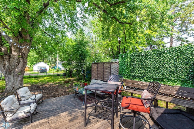 1538 10th St N, Fargo, ND 58102 - wooden deck with outdoor dining area and fence
