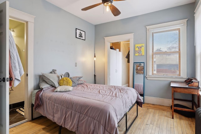3205 Grand Ave S, Minneapolis, MN 55408 - bedroom featuring light wood-style floors, baseboards, and ceiling fan