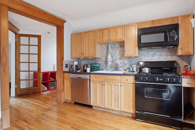 3205 Grand Ave S, Minneapolis, MN 55408 - kitchen featuring black appliances, decorative backsplash, light wood-style flooring, a sink, and light brown cabinets