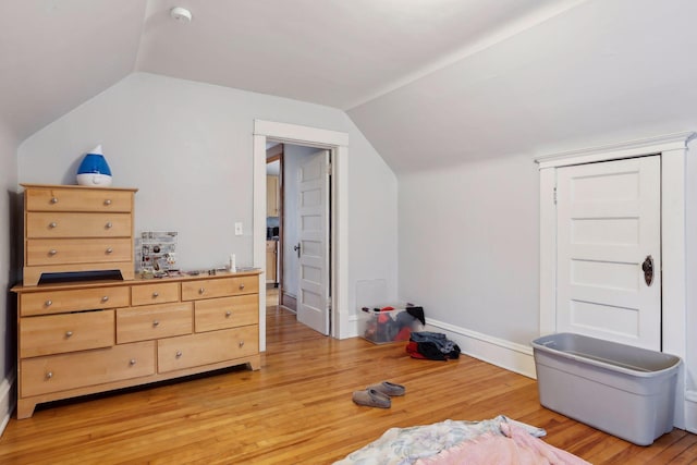 3205 Grand Ave S, Minneapolis, MN 55408 - additional living space featuring vaulted ceiling, light wood-style flooring, and baseboards