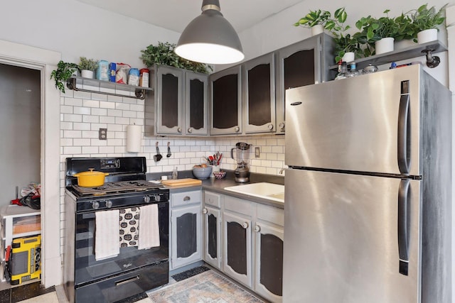 3205 Grand Ave S, Minneapolis, MN 55408 - kitchen featuring freestanding refrigerator, black gas range, a sink, decorative backsplash, and open shelves