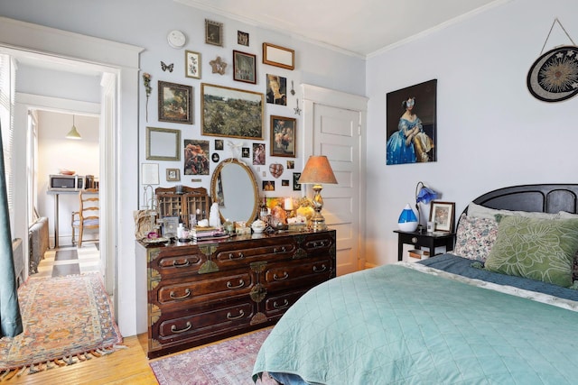 3205 Grand Ave S, Minneapolis, MN 55408 - bedroom with wood finished floors and ornamental molding