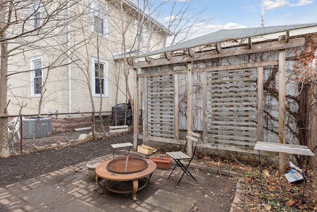 3205 Grand Ave S, Minneapolis, MN 55408 - view of patio featuring a fire pit, central AC unit, and fence