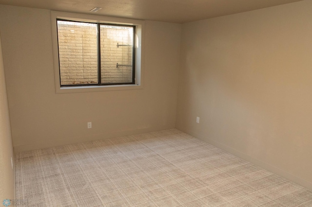 unfurnished room with carpet flooring