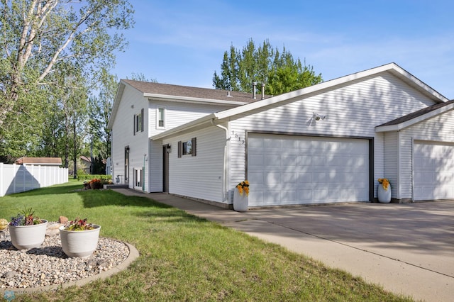 view of front of home with a garage and driveway