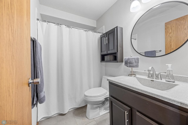full bathroom featuring toilet, tile patterned floors, vanity, and curtained shower
