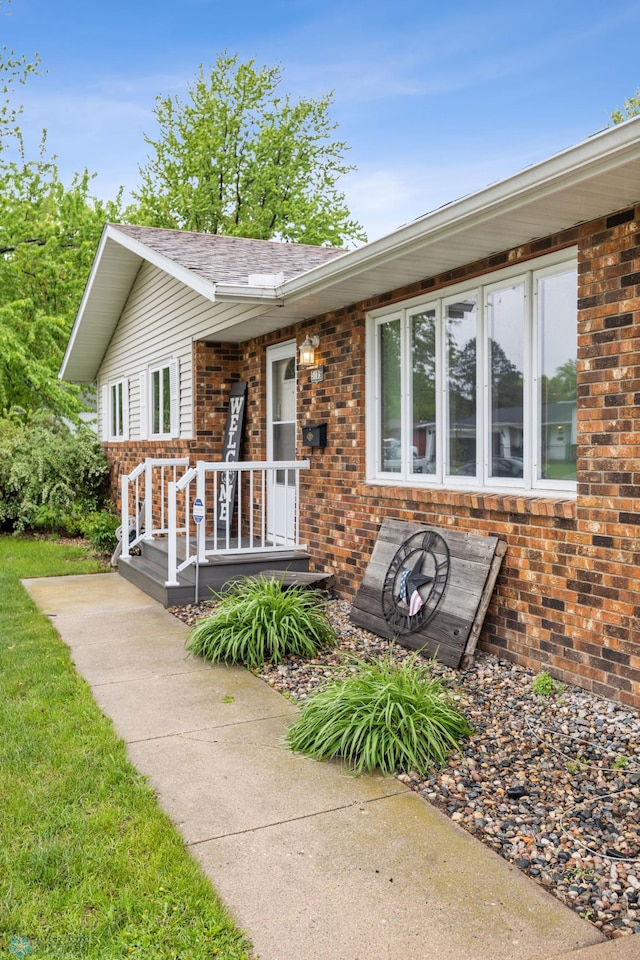 3105 Edgewood Dr N, Fargo, ND 58102 - ranch-style house featuring brick siding and roof with shingles