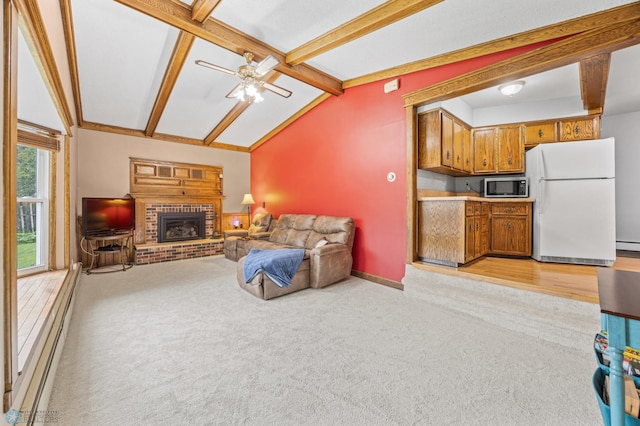 3105 Edgewood Dr N, Fargo, ND 58102 - living room featuring light carpet, a fireplace, a baseboard heating unit, ceiling fan, and baseboards