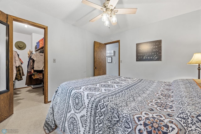 3105 Edgewood Dr N, Fargo, ND 58102 - bedroom featuring carpet, a walk in closet, a ceiling fan, and a closet