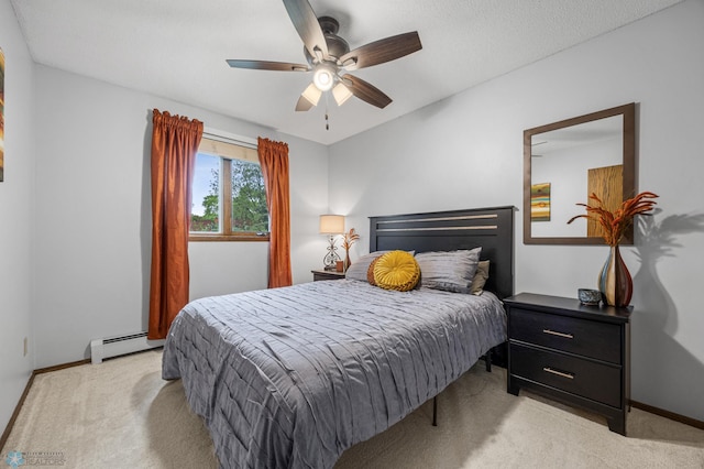 3105 Edgewood Dr N, Fargo, ND 58102 - bedroom featuring a baseboard heating unit, light colored carpet, baseboards, and ceiling fan