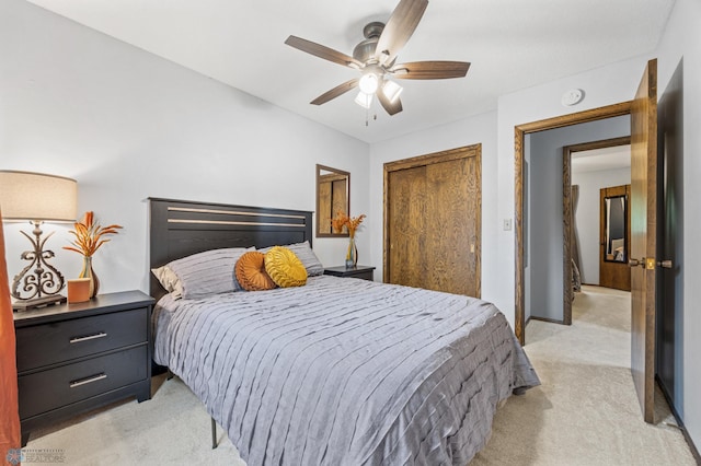 3105 Edgewood Dr N, Fargo, ND 58102 - bedroom with light colored carpet, a closet, a ceiling fan, and baseboards