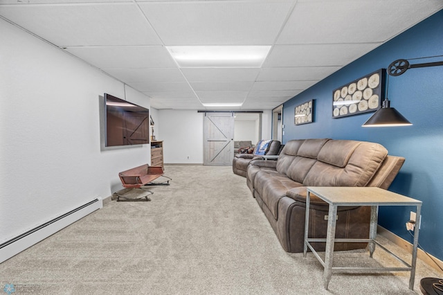 3105 Edgewood Dr N, Fargo, ND 58102 - carpeted living room featuring baseboard heating, a paneled ceiling, and baseboards