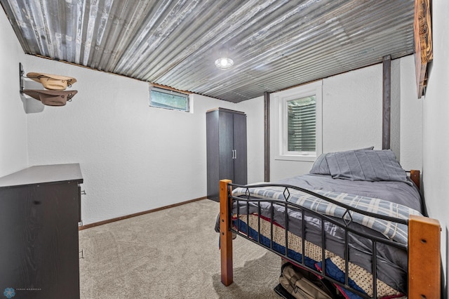 3105 Edgewood Dr N, Fargo, ND 58102 - carpeted bedroom featuring a textured wall and baseboards