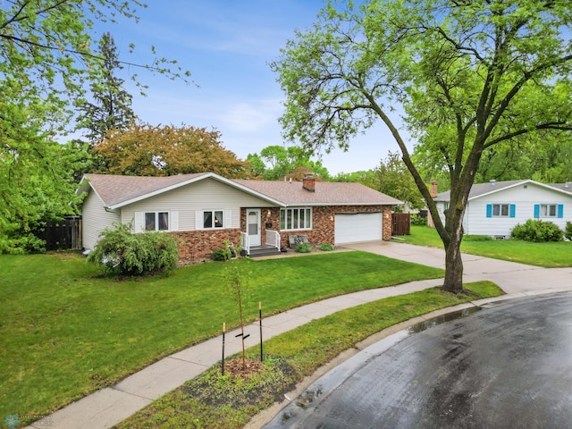 3105 Edgewood Dr N, Fargo, ND 58102 - ranch-style home with an attached garage, concrete driveway, and a chimney