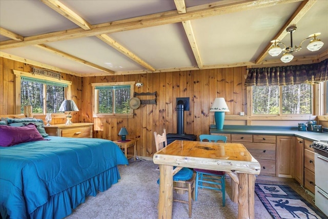 10397 Johnson Rd, Orr, MN 55771 - bedroom featuring a wood stove, light carpet, wooden walls, and beam ceiling