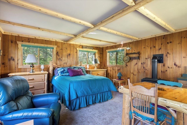 10397 Johnson Rd, Orr, MN 55771 - bedroom with carpet, beamed ceiling, a wood stove, and wooden walls