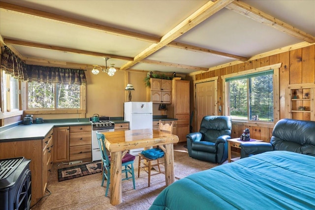 10397 Johnson Rd, Orr, MN 55771 - bedroom featuring freestanding refrigerator, light colored carpet, beamed ceiling, wooden walls, and a chandelier