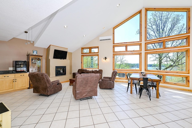 3818 Erickson Rd, Barnum, MN 55707 - living room featuring high vaulted ceiling, an AC wall unit, light tile patterned floors, a fireplace, and recessed lighting