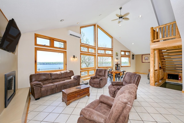3818 Erickson Rd, Barnum, MN 55707 - living room with a wall mounted AC, high vaulted ceiling, a glass covered fireplace, a ceiling fan, and light tile patterned floors