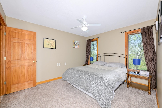 3818 Erickson Rd, Barnum, MN 55707 - bedroom featuring carpet floors, multiple windows, baseboards, and ceiling fan