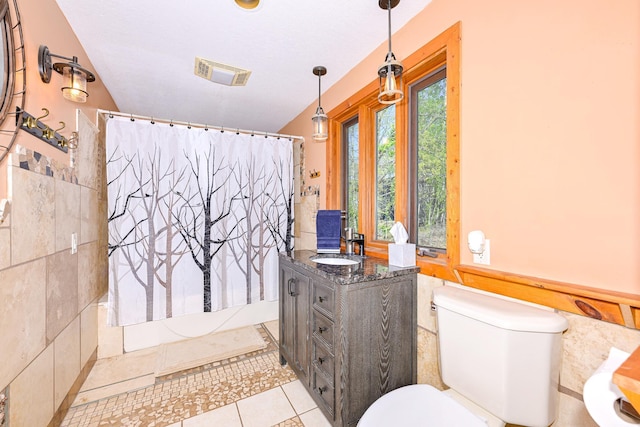 3818 Erickson Rd, Barnum, MN 55707 - full bathroom featuring tile patterned floors, toilet, shower / bath combination with curtain, and vanity