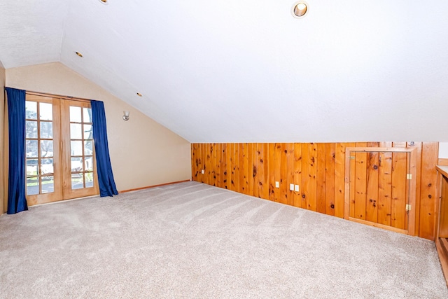 3818 Erickson Rd, Barnum, MN 55707 - bonus room with lofted ceiling, carpet floors, wooden walls, and baseboards