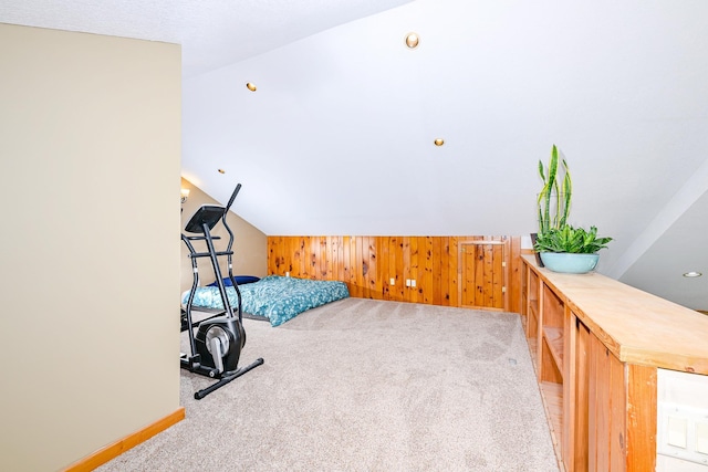 3818 Erickson Rd, Barnum, MN 55707 - bedroom featuring light colored carpet, baseboards, lofted ceiling, and wooden walls