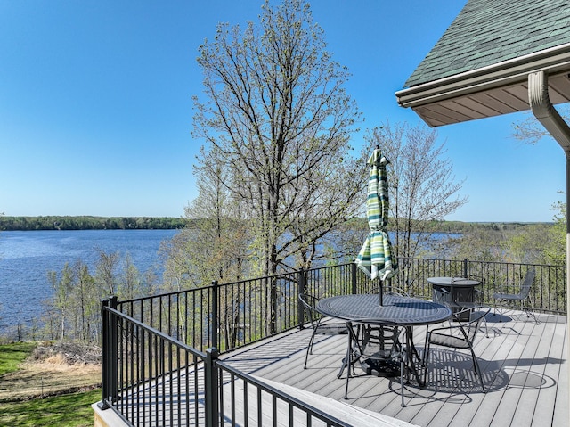 3818 Erickson Rd, Barnum, MN 55707 - wooden terrace featuring outdoor dining space and a water view