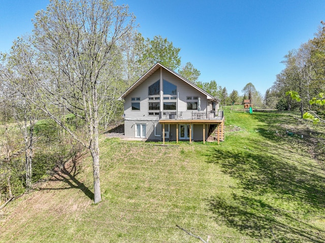 3818 Erickson Rd, Barnum, MN 55707 - back of property with a lawn, a deck, and a playground