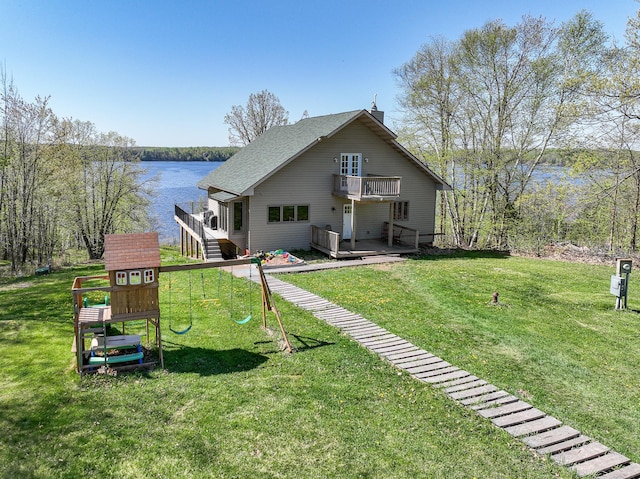 3818 Erickson Rd, Barnum, MN 55707 - rear view of property with a balcony, a playground, and a lawn