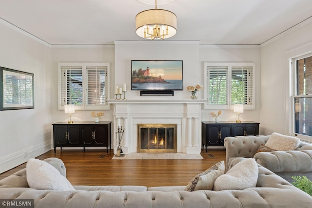 46 Crocus Pl, Saint Paul, MN 55102 - living room with wood finished floors, crown molding, baseboards, a fireplace with flush hearth, and a chandelier