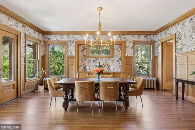46 Crocus Pl, Saint Paul, MN 55102 - dining area with wallpapered walls, a chandelier, a wainscoted wall, wood finished floors, and ornamental molding