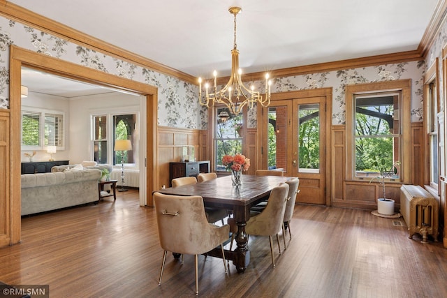 46 Crocus Pl, Saint Paul, MN 55102 - dining space with radiator, wallpapered walls, ornamental molding, a wainscoted wall, and a chandelier