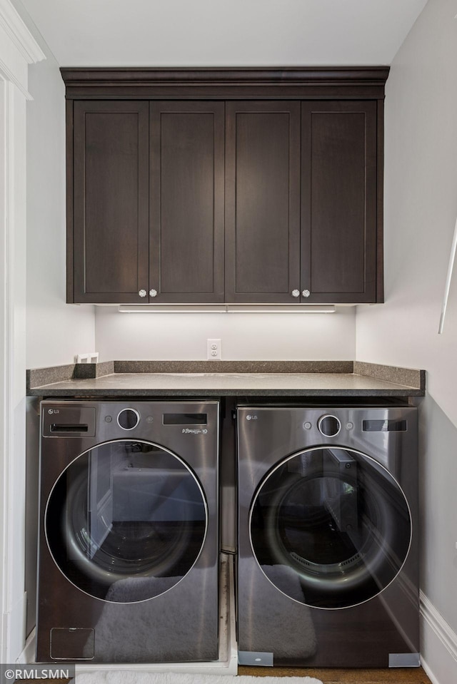 46 Crocus Pl, Saint Paul, MN 55102 - washroom with washer and dryer, cabinet space, and baseboards