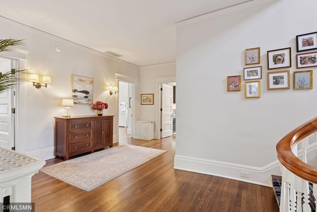 46 Crocus Pl, Saint Paul, MN 55102 - entryway with wood finished floors, baseboards, and ornamental molding