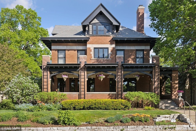46 Crocus Pl, Saint Paul, MN 55102 - back of house with brick siding and a chimney