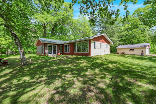 18587 Dover Rd, Clearwater, MN 55320 - back of house featuring a yard and a sunroom