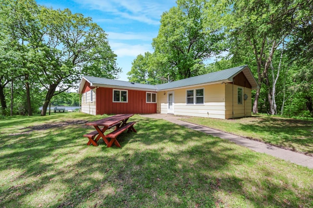18587 Dover Rd, Clearwater, MN 55320 - single story home with board and batten siding, a front yard, and metal roof