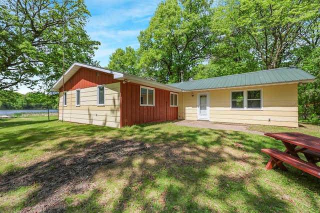 18587 Dover Rd, Clearwater, MN 55320 - ranch-style home with a front lawn, board and batten siding, and metal roof