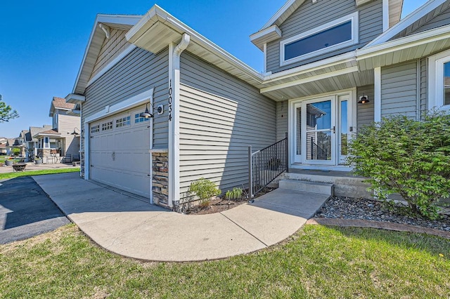 10034 191st Ave NW, Elk River, MN 55330 - entrance to property featuring an attached garage and driveway