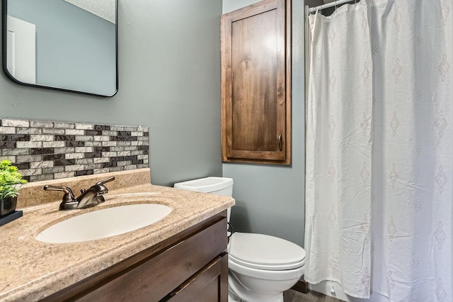 10034 191st Ave NW, Elk River, MN 55330 - full bathroom with decorative backsplash, toilet, vanity, and a shower with shower curtain