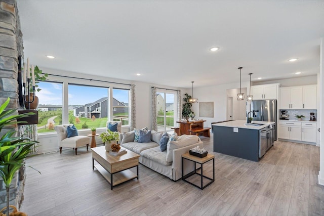 10082 Arrowwood Trl, Woodbury, MN 55129 - living area with light wood-style floors and recessed lighting