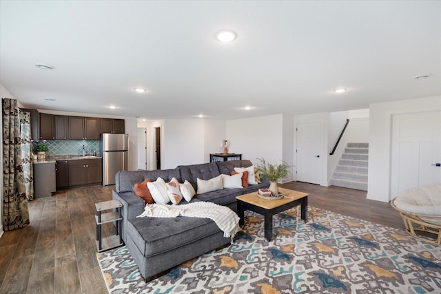 10082 Arrowwood Trl, Woodbury, MN 55129 - living area with dark wood-type flooring, stairway, recessed lighting, and bar