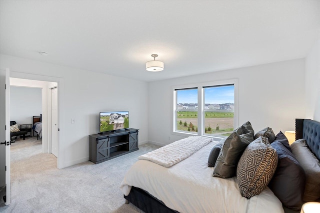 10082 Arrowwood Trl, Woodbury, MN 55129 - bedroom featuring light carpet and baseboards